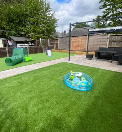 artificial lawn base using hardcore and a railway sleeper frame