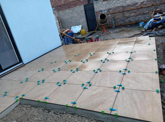 artificial lawn base using hardcore and a railway sleeper frame